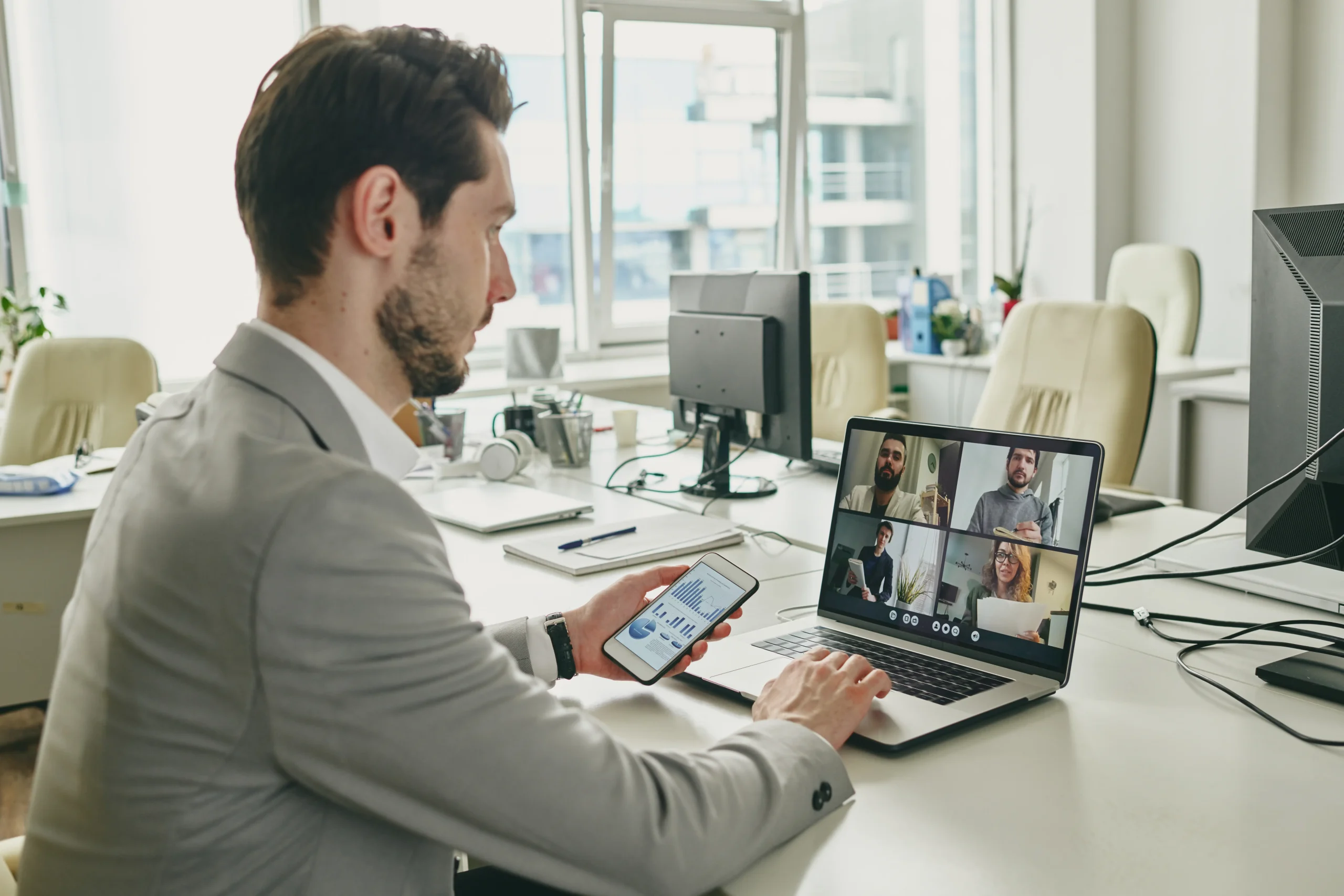 young-businessman-communicating-with-clients-onlin-2022-02-02-03-56-51-utc