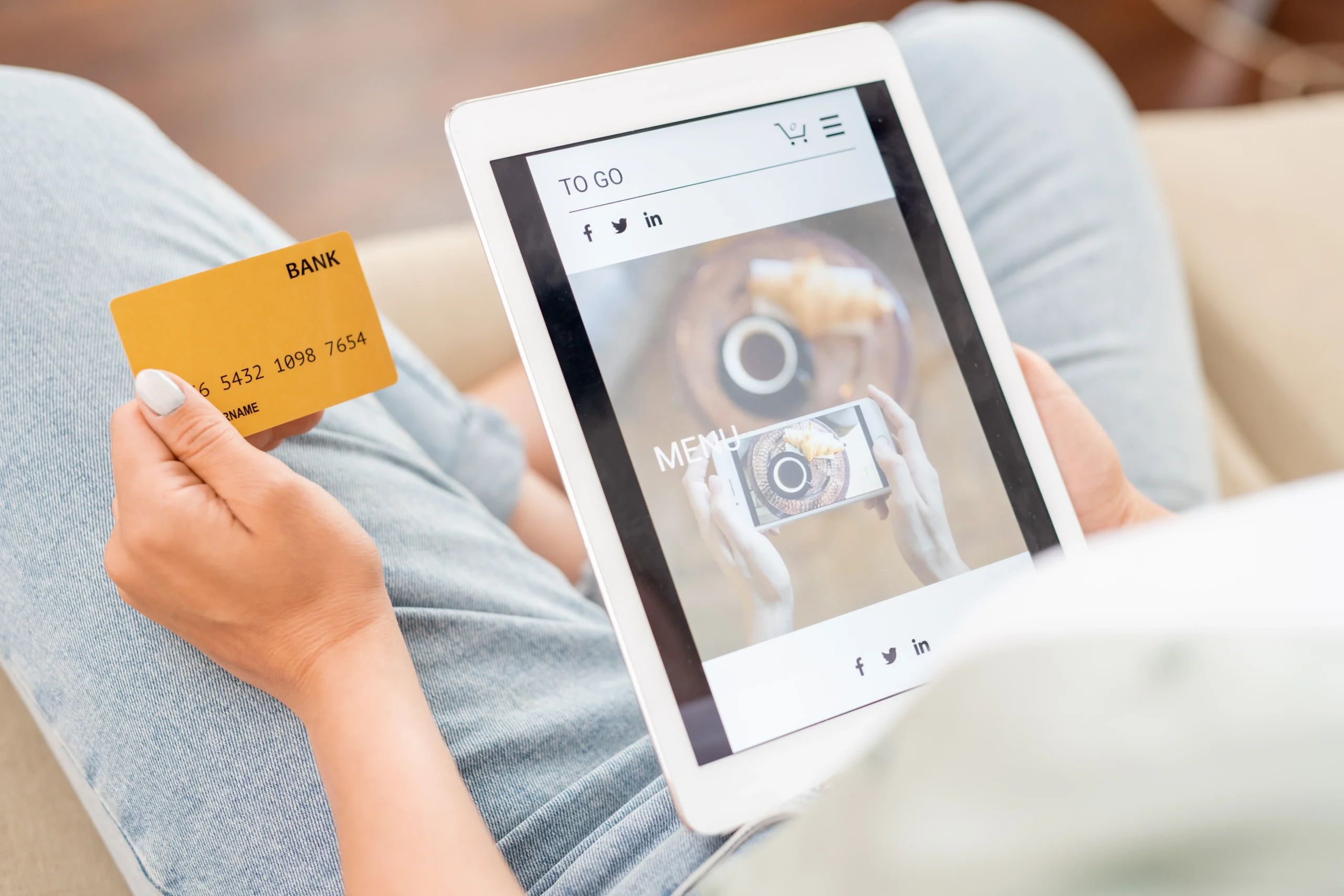 young-shopper-with-card-and-touchpad-scrolling-thr-2021-09-24-03-09-10-utc